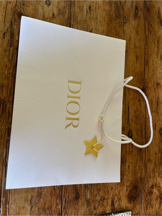 Dior Other - Dior Gold Star Charm on White Textured Bag